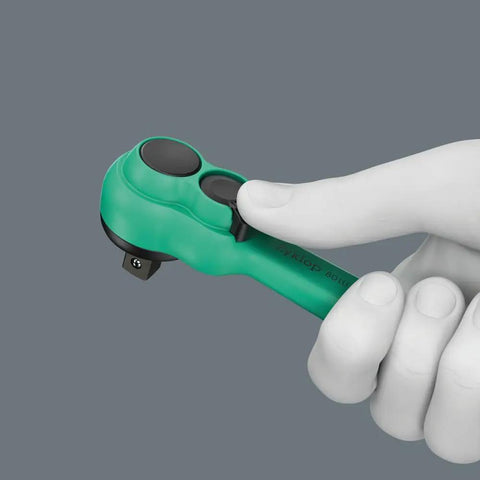 Hand holding Slim 1/4 Inch Drive Ratchet With Reversible Lever, 80-Tooth Gear Delivers Ultra Short 4.5 Degree Return, 144mm length