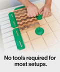 Person using the MatchFit CNC Clamping Kit For Woodworking And Milling, 11 Piece Green Set with Edge and U Pad Clamps.