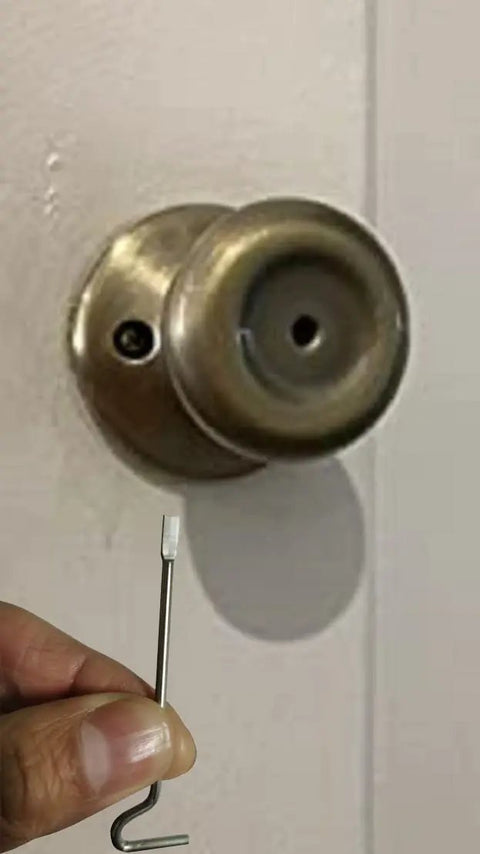 Top Shelf Emergency Key Kit For Interior Door Locks With Kwikset Schlage showing a brass tool next to a door lock.