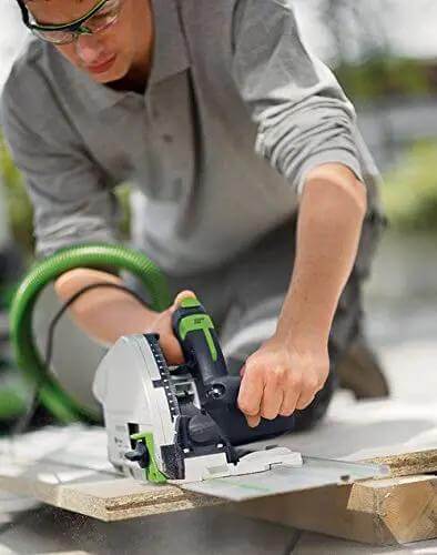 Precision Plunge Saw Featuring Slick Blade Swap Tech And Anti Splinter Guard For Crisp Cuts On Any Build, user performing a cut