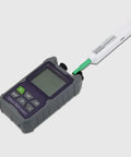 Handheld optical multimeter with attached white fiber-optic cleaning pen and green connector