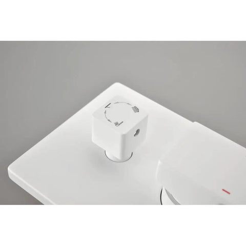 Close-up of control knob for Shower System with Waterfall Rainfall Head and Handheld, Wall-Mounted in white finish.