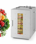 Top Tier 16 Tray Stainless Steel Food Dehydrator With Adjustable Temp Dial Electric Jerky Dryer next to fresh vegetables.