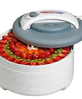 Straight Up Compact Food Dehydrator With Smooth Stainless Steel Trays For Whippin Up Homemade Beef Jerky Air Dried Fruit And Savory Snacks Without Cluttering Your Tiny Kitchen with various fruits prepared for drying.