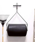 Powerful 270 Lb Poly Lawn Roller For Push Or Tow With Easy Turn Tethered Plug And Quick Filling Drum 18 By 24 Inches hanging in garage
