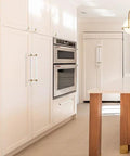 Kitchen cabinet with brushed brass and clear acrylic cabinet pulls, modern T bar design, 11.2 inch total length, 9 inch hole center.