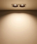 Sleek Five Pack Led Downlight Double Head Recessed Lighting Kit Featuring Deep Cup Wafer Design For Flush Ceiling Glare Free Illumination 14 Watt 24 Watt Options 3000K 4000K 6000K showing two lights illuminating a wall.