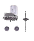 Front view of RC steel transmission gear set upgrade: motor, two gears, and long drive shaft with gear