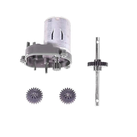 Front view of RC steel transmission gear set upgrade: motor, two gears, and long drive shaft with gear