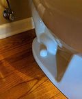 Installed toilet showing Toilet Bolt Cap Kit Black Includes Brass Bolts Nuts Washers And Caps To Stay Secure And Will Not Pop Off