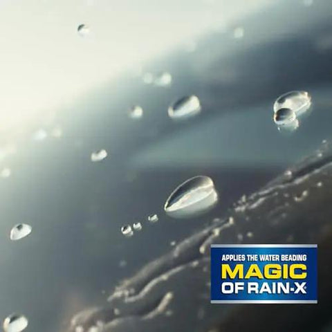 Close-up of water beads on a windshield showcasing Rain-X tech for All Weather 2-In-1 Windshield Wiper With Water Repellent Tech.