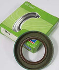 Grease Seals 12446 Stock Replacement Part For Bearings And Shafts Beefy Heavy Duty Rubber Seals box and seal displayed on a surface.