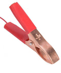 Close-up of a red and copper clamp for 20W Monocrystalline Solar Charger Outdoors With Dual DC Output And USB Goes Off Grid For 12V Batteries Powers Camping And RV Life Weatherproof Silicon Panel High Efficiency Eco Friendly.