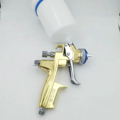 Straight Up Professional Pneumatic Paint Spray Gun Featuring High Atomization Nozzle Gravity Feed Build for Car Painting and Leather Repair Jobs. Gold spray gun with top-mounted reservoir.