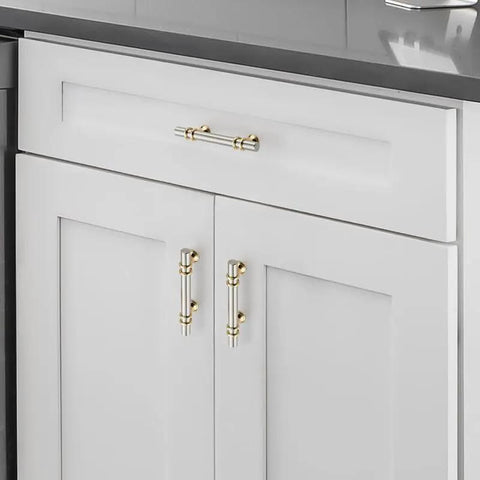 Snag These Fly Dual Tone Brushed Nickel And Gold Cabinet Pulls Featuring 3 Inch Center To Center Spacing on white cabinets.