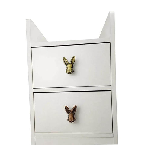 White dresser with Cute 4 Pack Rabbit Drawer Knobs With 3D Bunny Head Design For Kids Rooms And Furniture Zinc Alloy Decorative Cabinet Pulls With Antique Finish Bolwhao in black and gold.