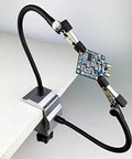Soldering Iron Holder Bench Vise Aluminum Table Clamp Station With 360 Degree Rotated Clips Locked In Place By Knurled Thumb Nuts Helping Hands With 2 Flexible Arms And Pro Grade Anti Slip Rubber Pad For Stable PCB Soldering in use.