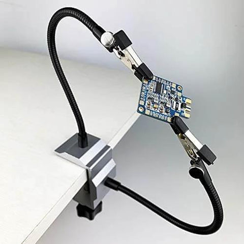Soldering Iron Holder Bench Vise Aluminum Table Clamp Station With 360 Degree Rotated Clips Locked In Place By Knurled Thumb Nuts Helping Hands With 2 Flexible Arms And Pro Grade Anti Slip Rubber Pad For Stable PCB Soldering in use.