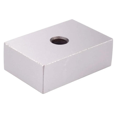 Front view of a hardened steel machinist block, 1x2x3 in, with a central hole.