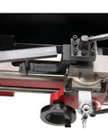 Wood turning tool rest and spur center on mini/bench lathe, side view, height adjustable, metal gray.