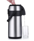 Top Shelf 304 Stainless Steel Insulated Thermal Carafe With Slick Push Button Dispenser pouring into a glass.