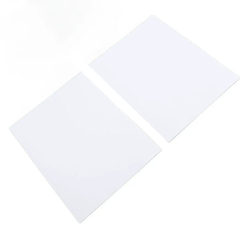 Two white Top Tier Industrial Machine Cleaner Sheets for removing grease and grime from metal parts.