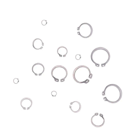 Assorted sizes of 304 stainless steel retaining circlips from Heavy Duty External Snap Ring Kit 225 Pcs Pro Grade for mechanical repair.