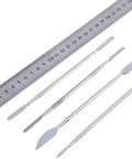 No Sweat 37 Piece Watch Repair Kit And Smartphone Teardown Set With Precision Drivers showing silver tools and a measuring ruler.
