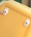 Heavy Duty Self Adhesive Furniture Casters With Stainless Steel Swivel Rollers And 360 Degree Glide Wheels attached to a yellow storage bin.