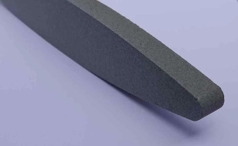 Close-up of Two Cow Scythe Sharpening Stone With One Eighty Grit Silicon Carbide Wet Stone For Scythes, 9-inch detail view.