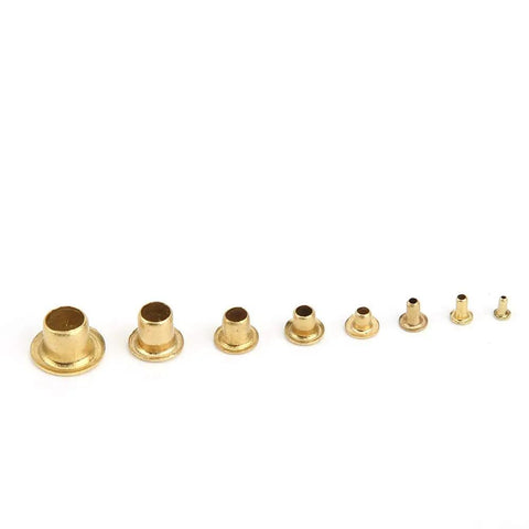 Various sizes of brass eyelets from the 650-Piece Brass Eyelets And Rivets Buttonhole Kit For Shoes, Hats, Shirts, Belts, Backpacks, And Jackets