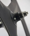Close-up of Tri Spoke 88mm Carbon Wheelset For 700c Clincher Fixed Gear Track Bikes, hub detail, lightweight carbon material