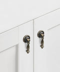 Front view of 4 Pack Decorative Bronze Drawer Pulls Set With Screws Vintage Copper Door Handles on white cabinet doors