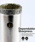Diamond hole saw bit, metal body with diamond-coated tips, close-up view.
