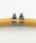 Five Pack Brass Garden Hose Connectors For Half Inch Hoses With Stainless Steel Clamps Hose Mender Kit For Quick Repair And Leak Proof Extended Connections showing close-up of brass connector installed on hose with steel clamps