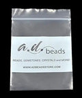 Plastic packaging with a.d. beads logo, featuring a clear, resealable bag for beads or gemstones storage.
