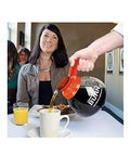 Coffee Pot Decanter Carafe Set With 12 Cup Capacity, Three Pieces Including Two Black Regular And One Orange Decaf in use