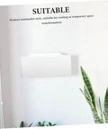 Wall-Mounted Bathroom Sink - Space-Saving Plastic Wash Basin for Small Restrooms, No-Drill Installat, shown on a wall with plants.