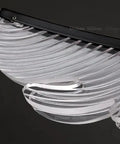 Close-up view of Dope Modern Pendant Light Fixture, clear acrylic design, sleek black metal accents, ideal for stylish home upgrades.
