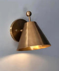Handcrafted Brass Wall Sconce with Finial Vintage Hardwired Light featuring a cone-shaped shade and decorative finial.