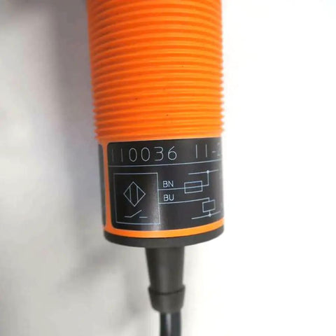 Close-up of II0036 IIA 2015 ABOA 6M Proximity Switch Sensor New Orange Industrial Grade Automation Part For Easy Mounting