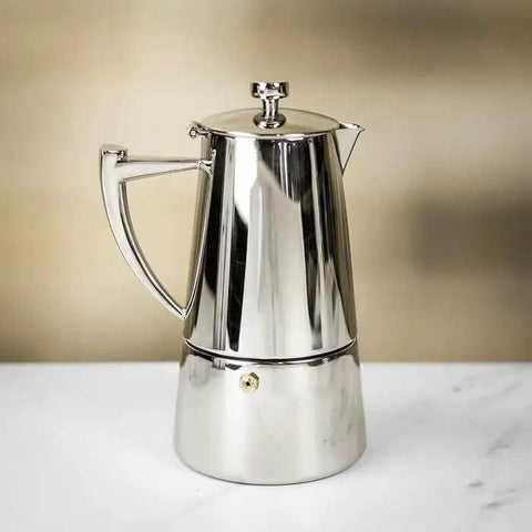 Stainless Steel Stovetop Espresso Maker For 6 Cups Easy To Clean Moka Pot with heat-resistant design on a countertop