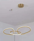 Statement Piece Stainless Steel LED Pendant Chandelier With Gold Ring Accents Adjustable Hanging Lamp For Dining Rooms, three rings design.
