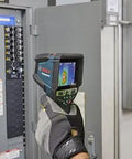 Hand holding 12V Max Connected Thermal Camera With 500 Sharp Thermal Images Storage For On Site Inspections, Pro Grade Intuitive One Tap Interface