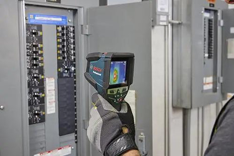 Hand holding 12V Max Connected Thermal Camera With 500 Sharp Thermal Images Storage For On Site Inspections, Pro Grade Intuitive One Tap Interface