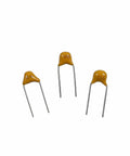 Three MLCC multilayer monolithic capacitors from Starter Pack Ceramic Capacitor Kit With 30 Values And 600 Pieces For DIY Electronics