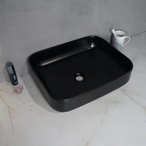 USZWBY Vessel Sinks Modern Simple Household Black Wash Basin Ceramic Above Counter Hotel Bathroom Countertop Sink from the top view.