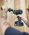 Heavy Duty Cordless Percussion Drill With Real Deal Masonry Punching Power And Smooth Woodworking Flow Including Forstner Bit Compatibility Plus No Nonsense Workhorse Design Tool Only in use with a wooden wall.