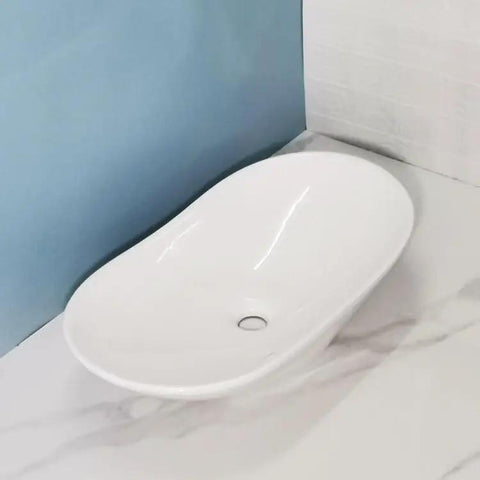 Bathroom Sink Modern Minimalist Art Basin Hotel Bathroom Ceramic Above Counter Basin Balcony Single Basin Bathroom Cabinet Wash Basin Bathroom Sink Vessel on marble surface.