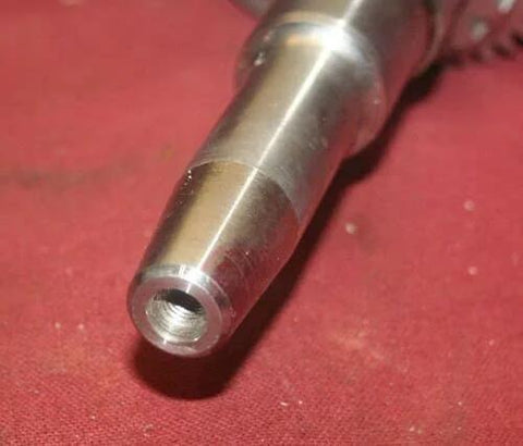 Close-up of straight crank shaft adapter taper in alloy steel with hollow threaded bore
